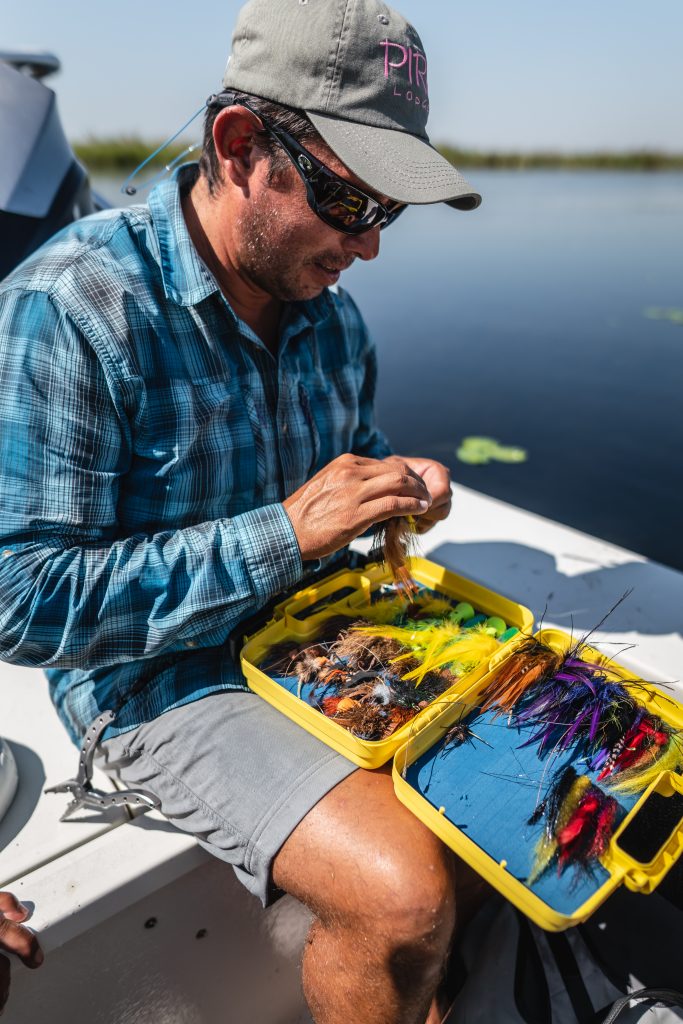 Guide preparing his flies PH River Wizards scaled